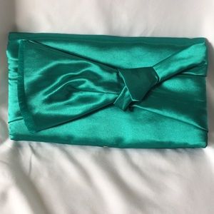 Eva Lorenzeotti teal green clutch